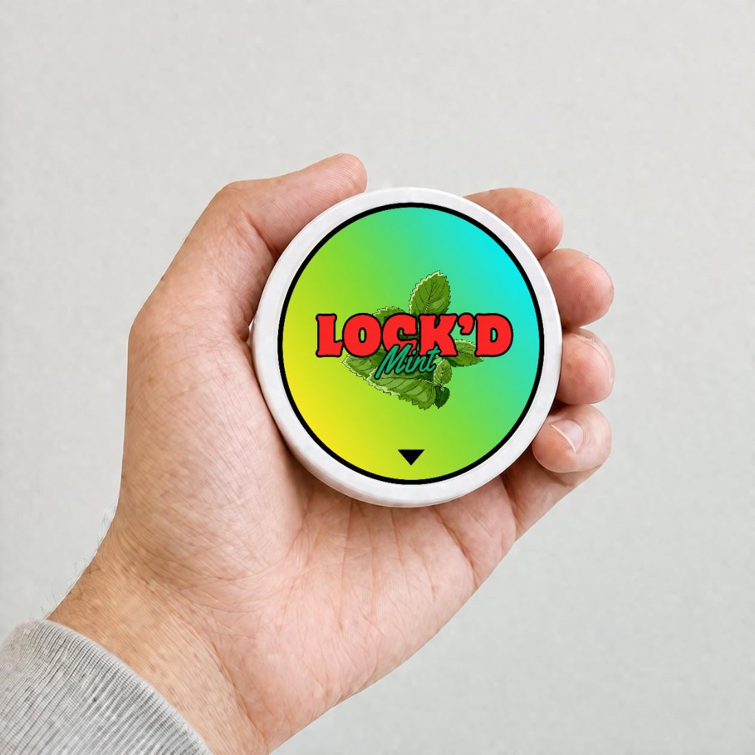 LOCK'D Mint single tin held in a hand